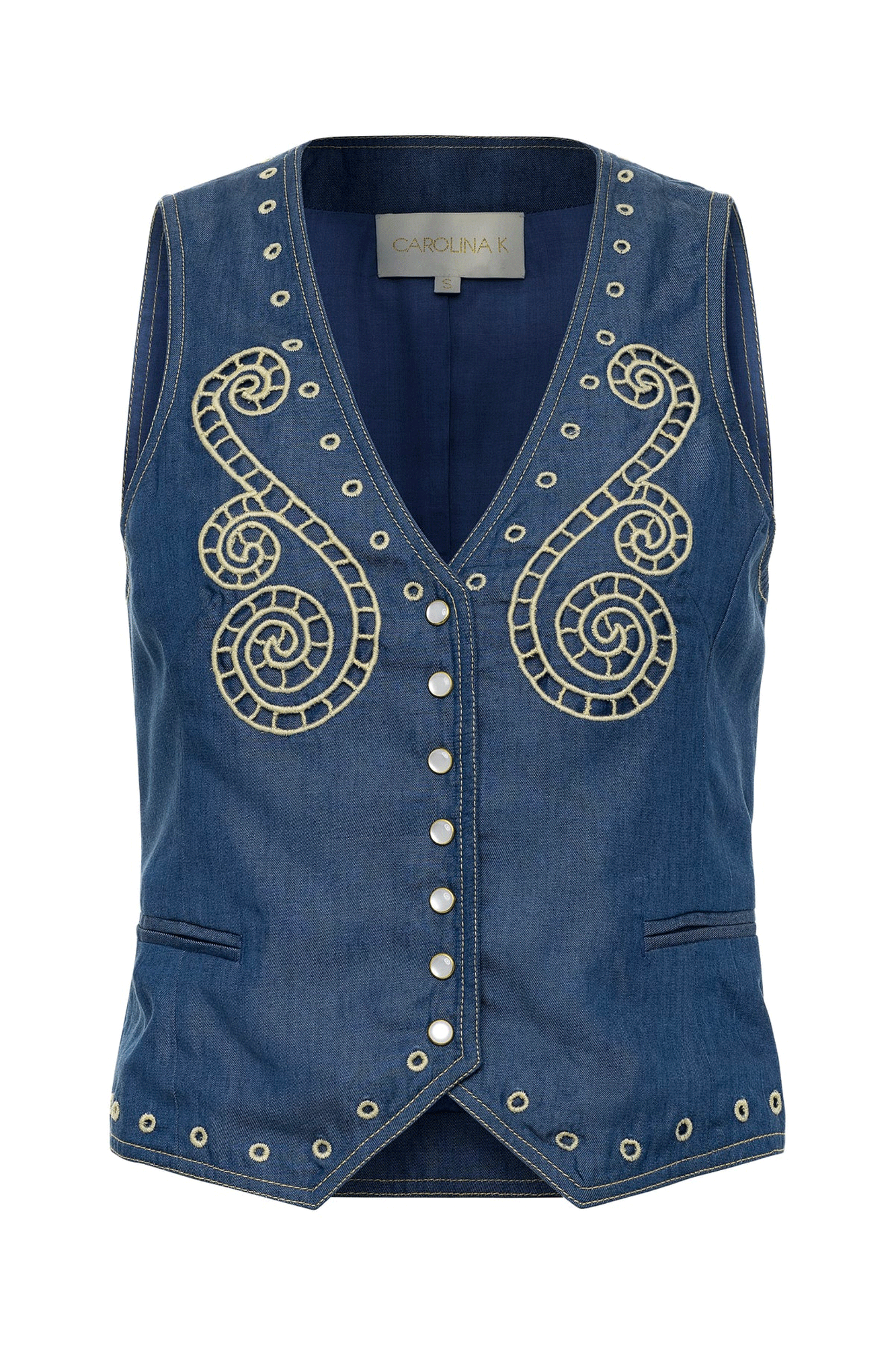 The Sun Vest from Carolina K is a stylish and functional addition to your wardrobe. Featuring an embroidered design, two side front pockets, a deep V-neck, and a lined interior, this vest offers a comfortable and attractive fit. Thanks to its front button closure, you can easily adjust the fit to suit your needs.