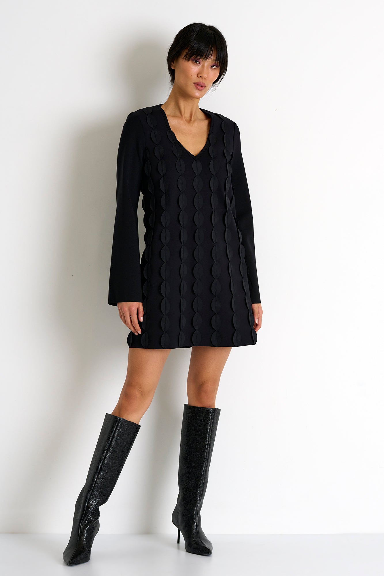 The Lydia Scallop Dress from Shan is designed with Italian 3D jersey fabric for a comfortable fit. 