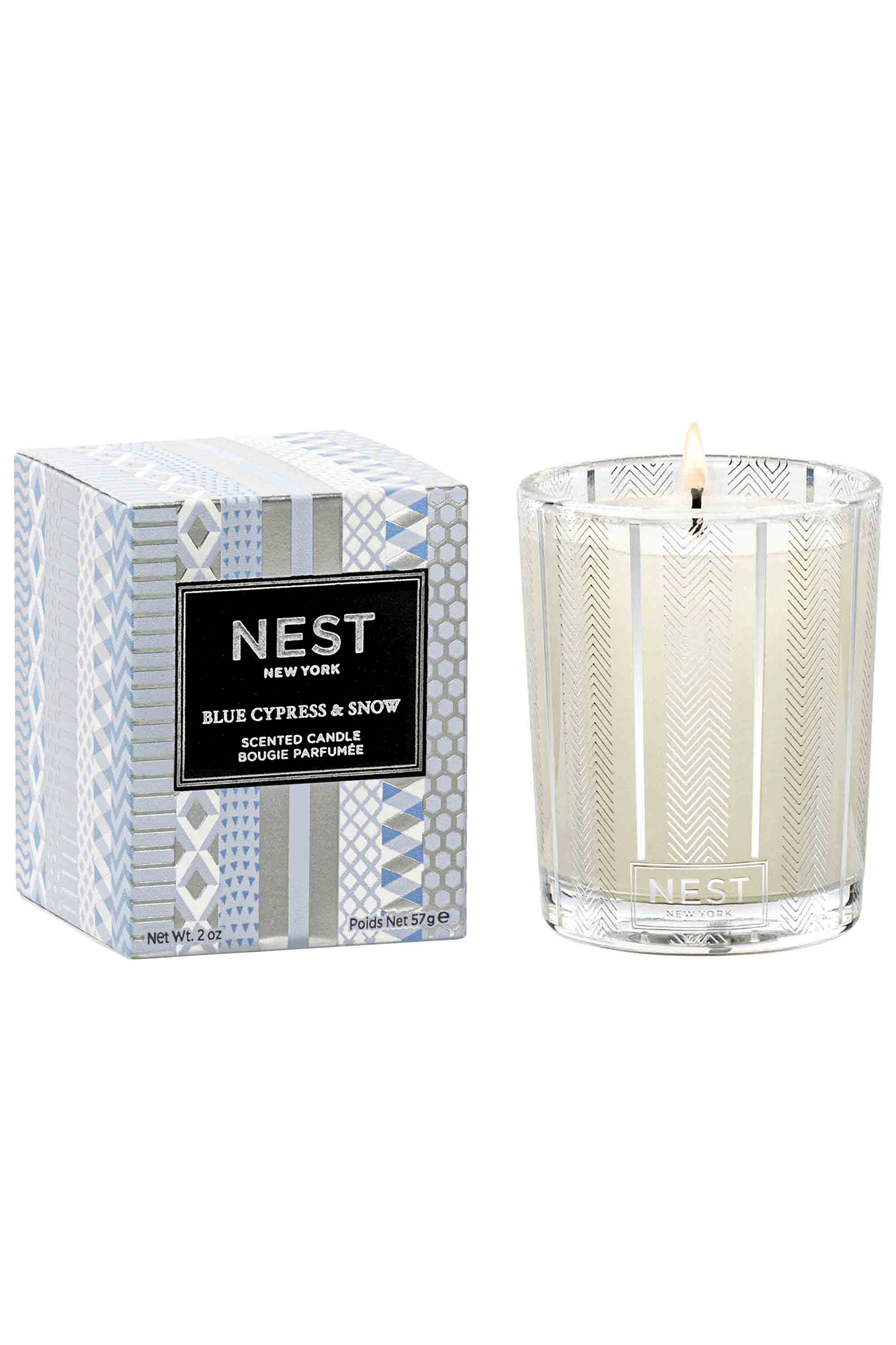 This beautiful Blue Cypress & Snow Votive Candle from Nest is perfect for adding an earthy yet warm aroma to your home. Enjoy top notes of blue cypress, juniper berry and a subtle hint of smoked vanilla bean. Create a unique winter mountain retreat atmosphere with this Classic Candle.