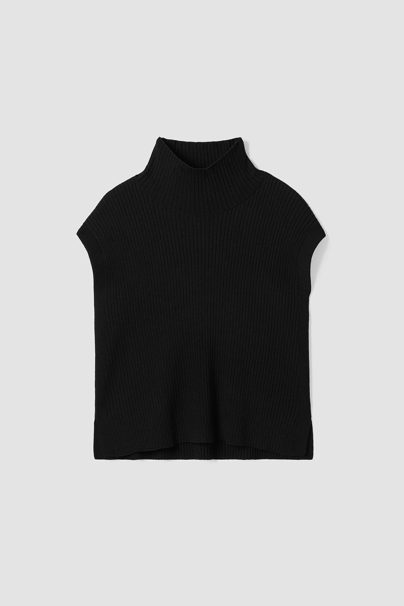 The Sleeveless Turtleneck from Eileen Fisher has an incredibly soft and luxurious feel. Expertly tailored with a timelessly elegant turtleneck and cap sleeves, its relaxed silhouette is finished with side slits for modern sophistication. 