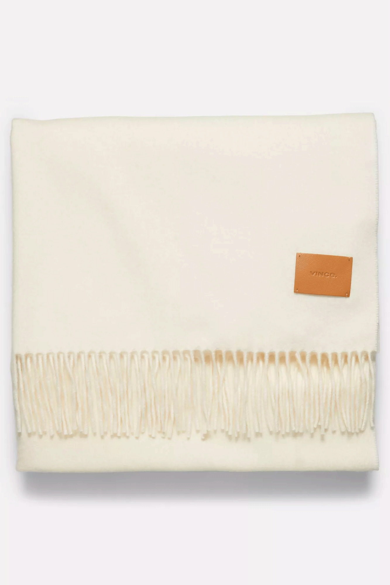 This Mill Merino Fringe Wrap from Vince available at Schreiner Goods in store and online is crafted with carefully selected premium wool, giving it a luxuriously soft feel. The timeless design is finished with a timeless fringe trim, making it perfect for any occasion.