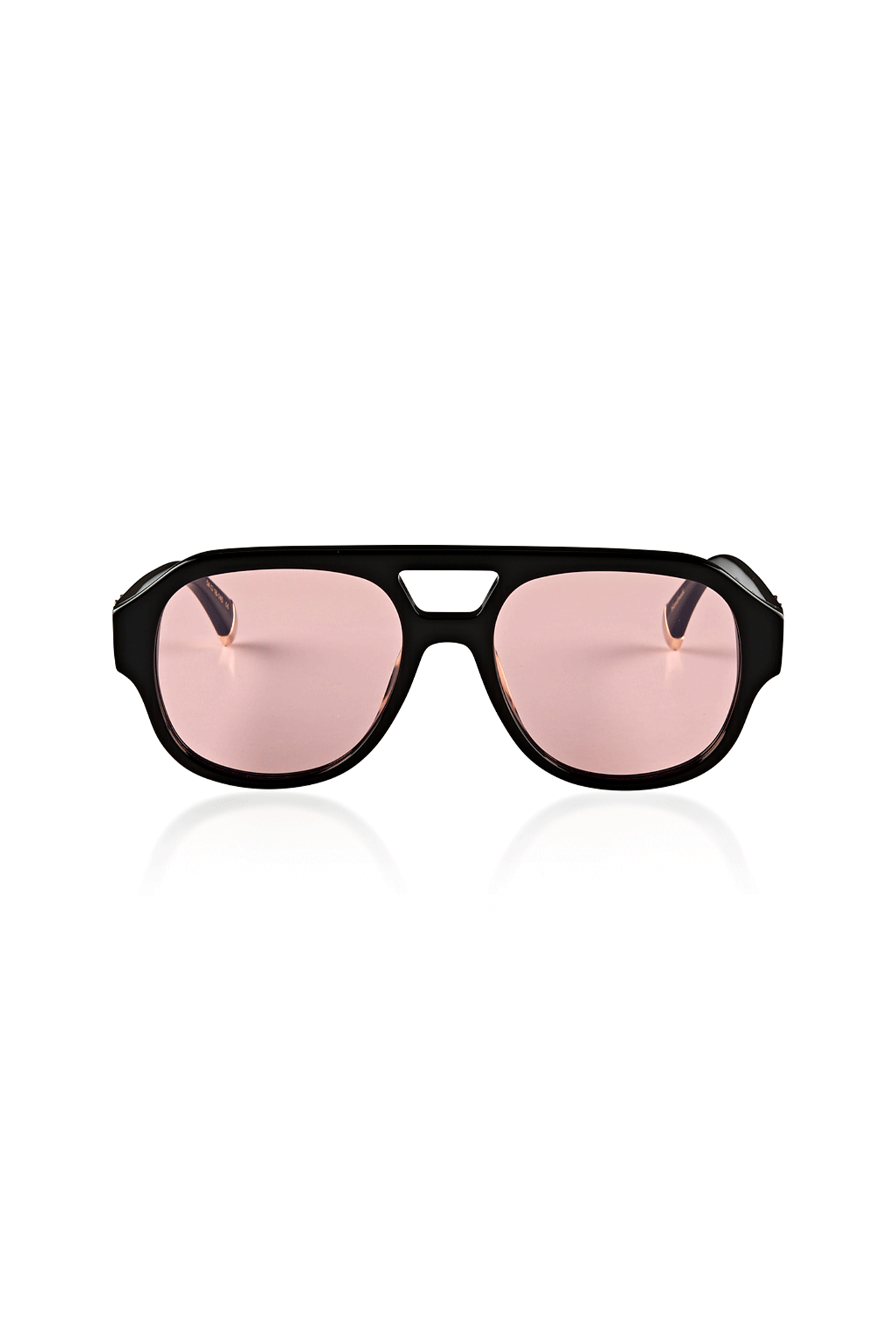 The Le Style Gloss Black - Pink Lens from Oscar x Frank is perfect for both men or women looking to make a statement. This handcrafted frame is made of Italian acetate, has an oversized X logo, and 24K gold temple tips. Its unique lenses can transform from pink to grey in direct sunlight, offering maximum sun protection all while staying fashion-forward. 100% designed in-house.