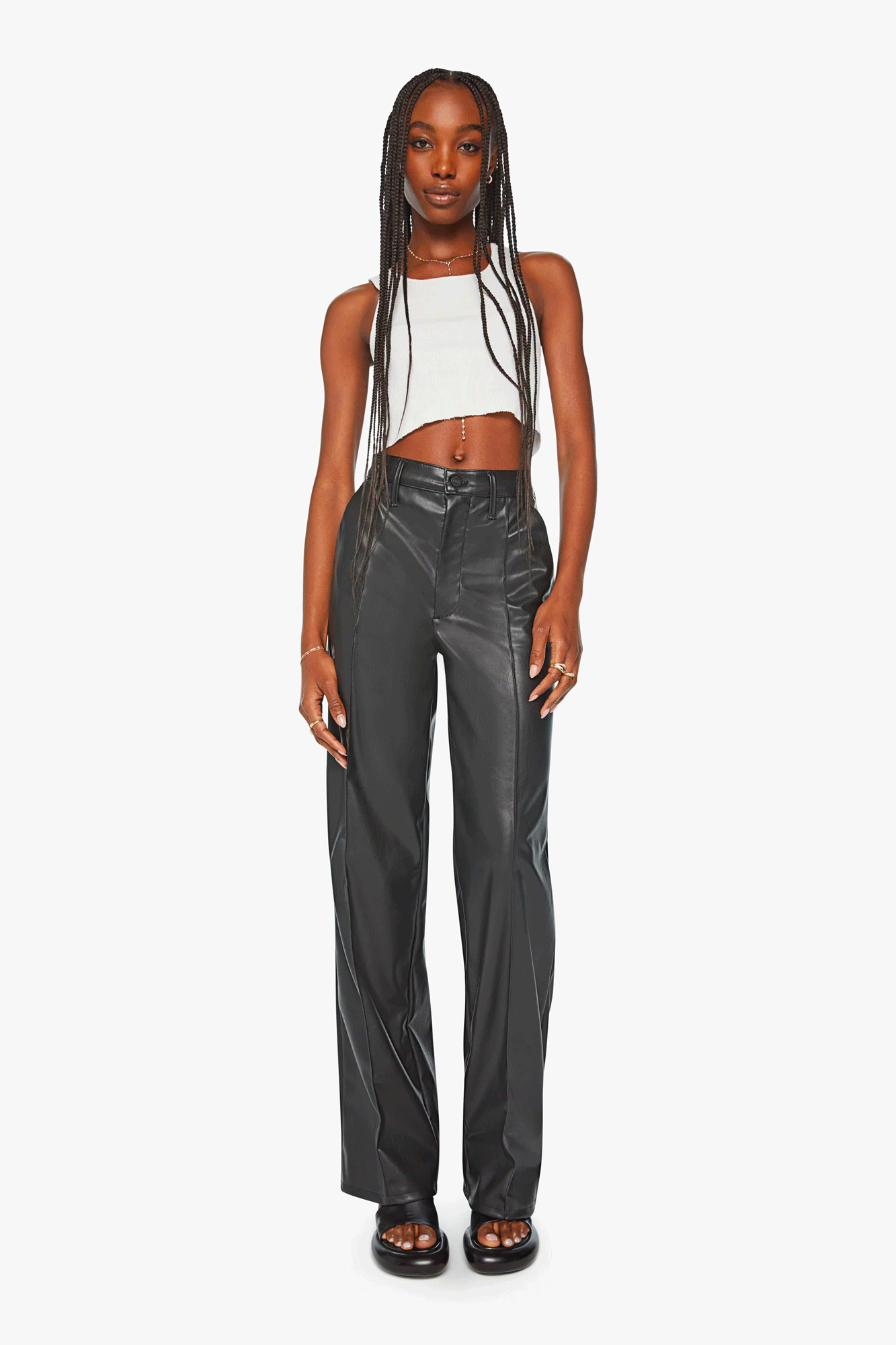 Experience elevated style in these high-waisted pants from Mother with a wide, loose leg. Crafted from a buttery soft faux leather, the pants feature a button fly and pintuck detailing on the front. Finished with an ankle-length inseam and a clean hem. Stand out in comfort and sophistication.