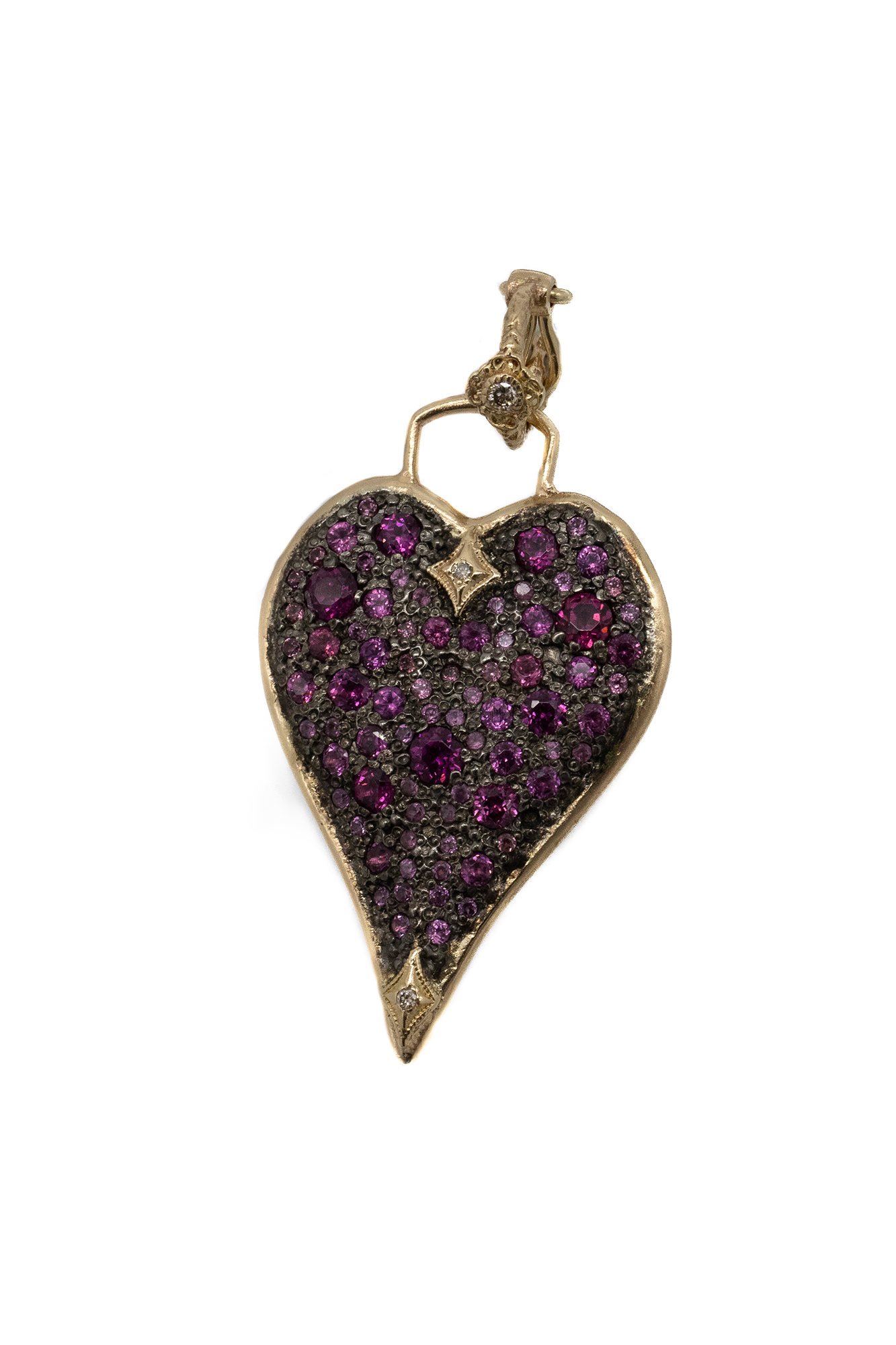 This sophisticated enhancer crafted from 14K Yellow Gold and Gunmetal Sterling Silver from Armenta is a unique accessory that will add an elevated touch to any look. Its 30mm heart shield is adorned with a sparkling champagne diamond and pave rhodolite accents. Perfect for any occasion.