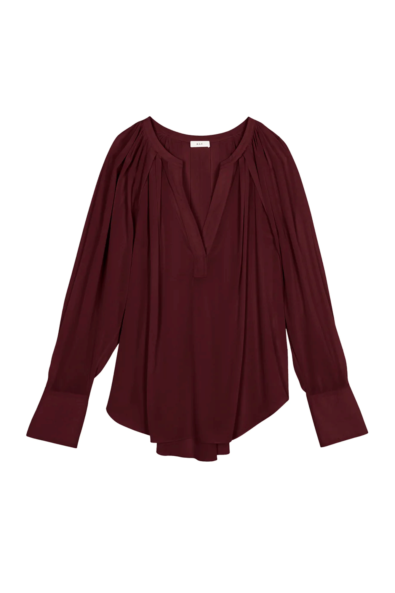 The Nomad Top from A.L.C. is an elegant statement piece crafted from a luxurious stretch silk fabric. With cuffed voluminous sleeves, a V-shaped placket neckline, and pleating at the back, this top features designer details for a timelessly polished look.