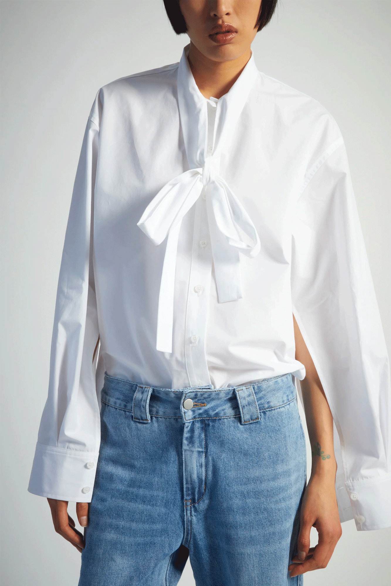 Elevate your wardrobe with the Kimberly Bow Tie Blouse from Saint Art.