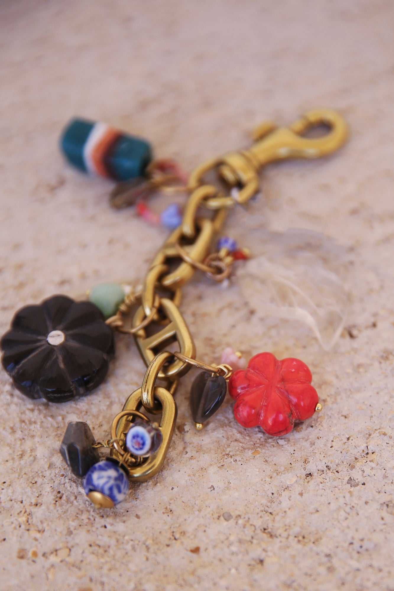 Brass Bag Charm w/ Quartz Leaf, Red Magnesite Flower, Horn Flower, Jade Heart, Czech Glass, + Ghanaian Sandcast Bead