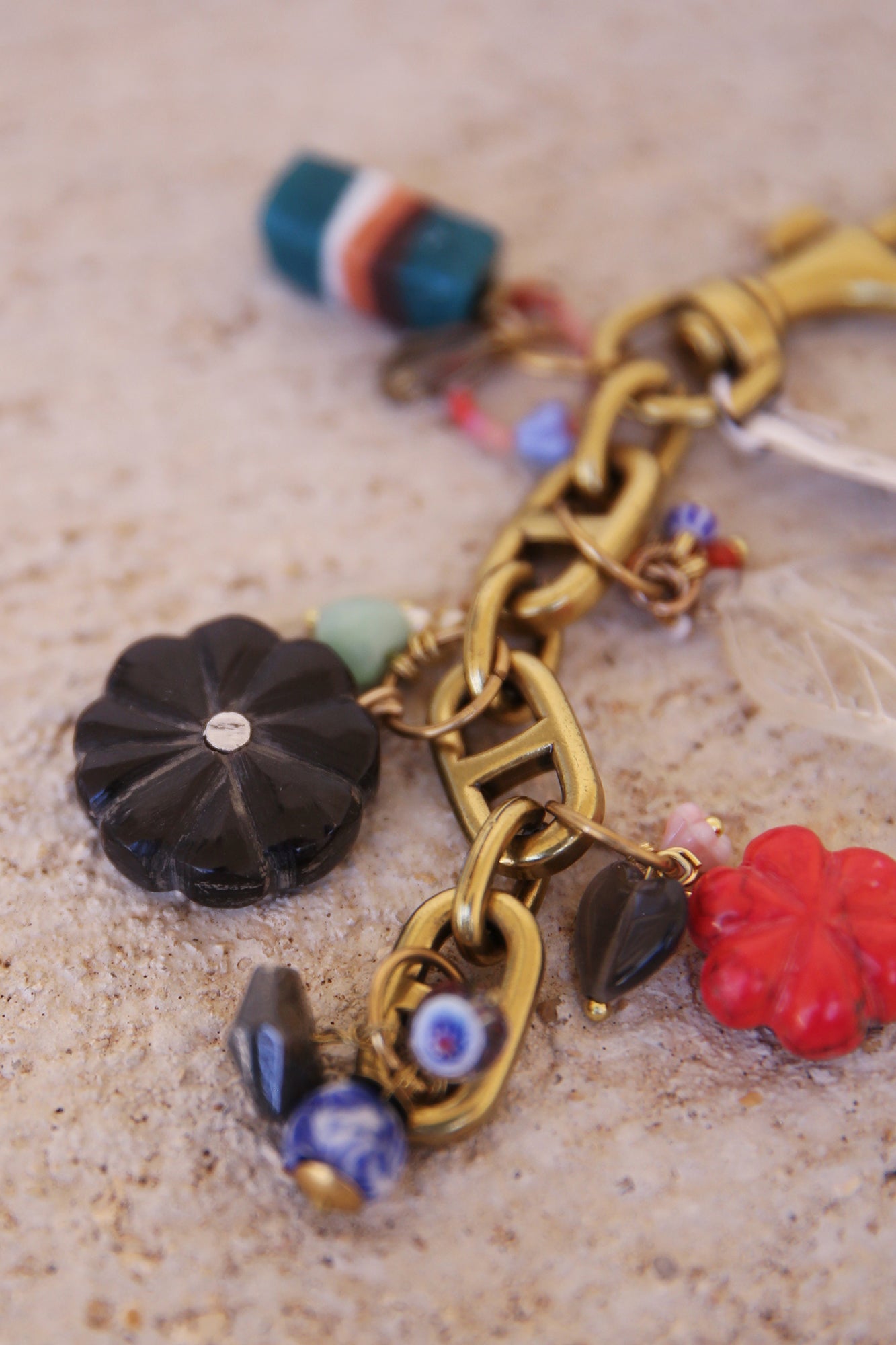 Brass Bag Charm w/ Quartz Leaf, Red Magnesite Flower, Horn Flower, Jade Heart, Czech Glass, + Ghanaian Sandcast Bead