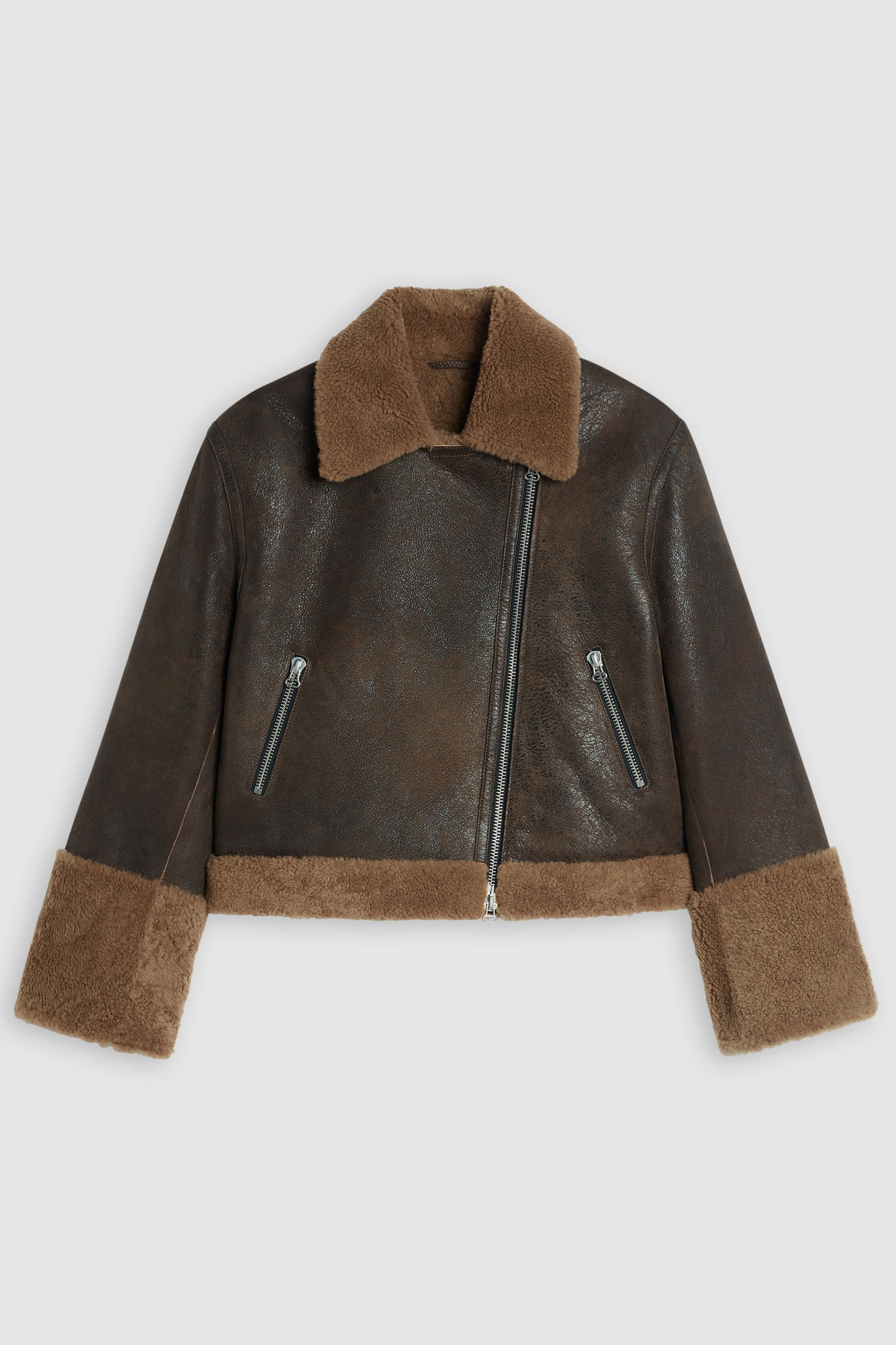 This stylish Biker jacket from Closed is crafted from premium Spanish shearling and tanned close to Barcelona. It features a leather exterior with a matt look and soft shearling interior for enhanced comfort. Other features include diagonal zip closure, zip pockets, and wide sleeve cuffs. Upgrade your wardrobe with this luxurious, timeless design.