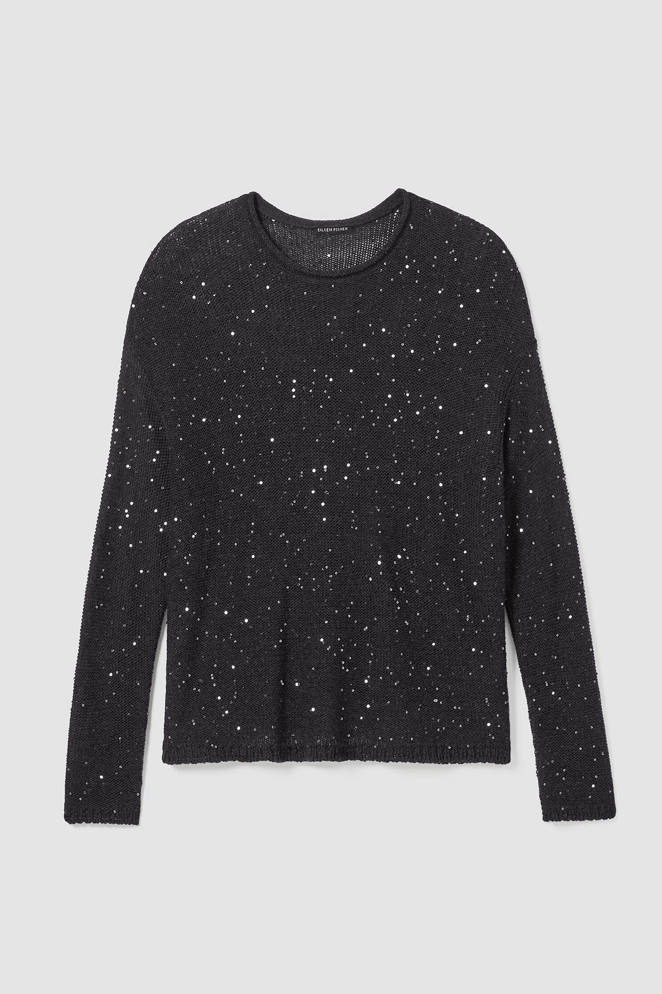 Look effortlessly stylish with our Crew Neck Pullover from Eileen Fisher, featuring a classic crew neck design highlighted by shimmering sequins. Crafted from quality Merino wool, this pullover is not only soft and comfortable, but is also better for the environment thanks to the land-friendly production methods.