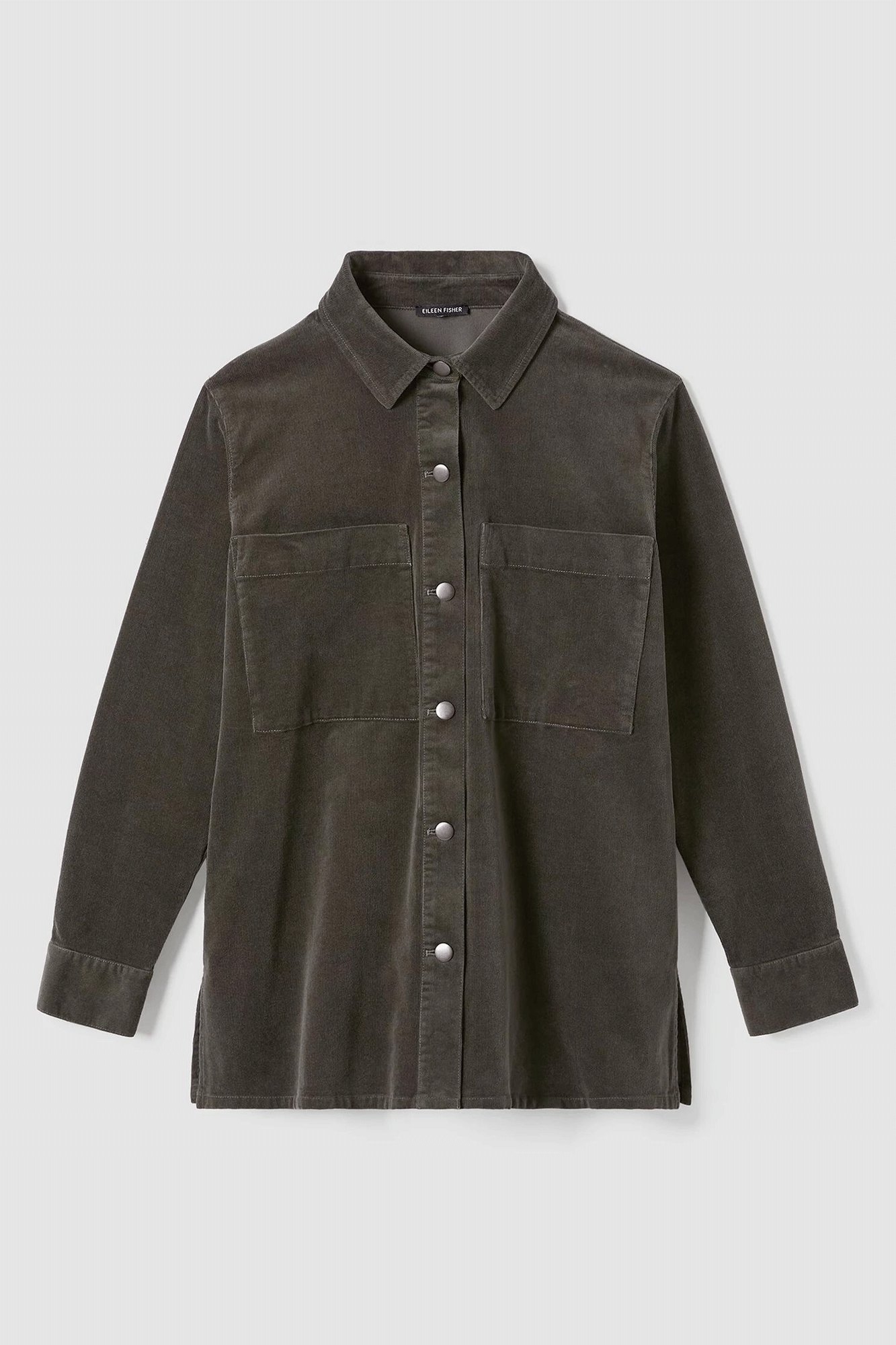 This classic collar shirt jacket from Eileen Fisher is made from corduroy and features a hint of stretch for a comfortable fit. With front patch pockets and a relaxed fit, it offers the style of a jacket with the convenience of a shirt. Perfect for everyday wear.