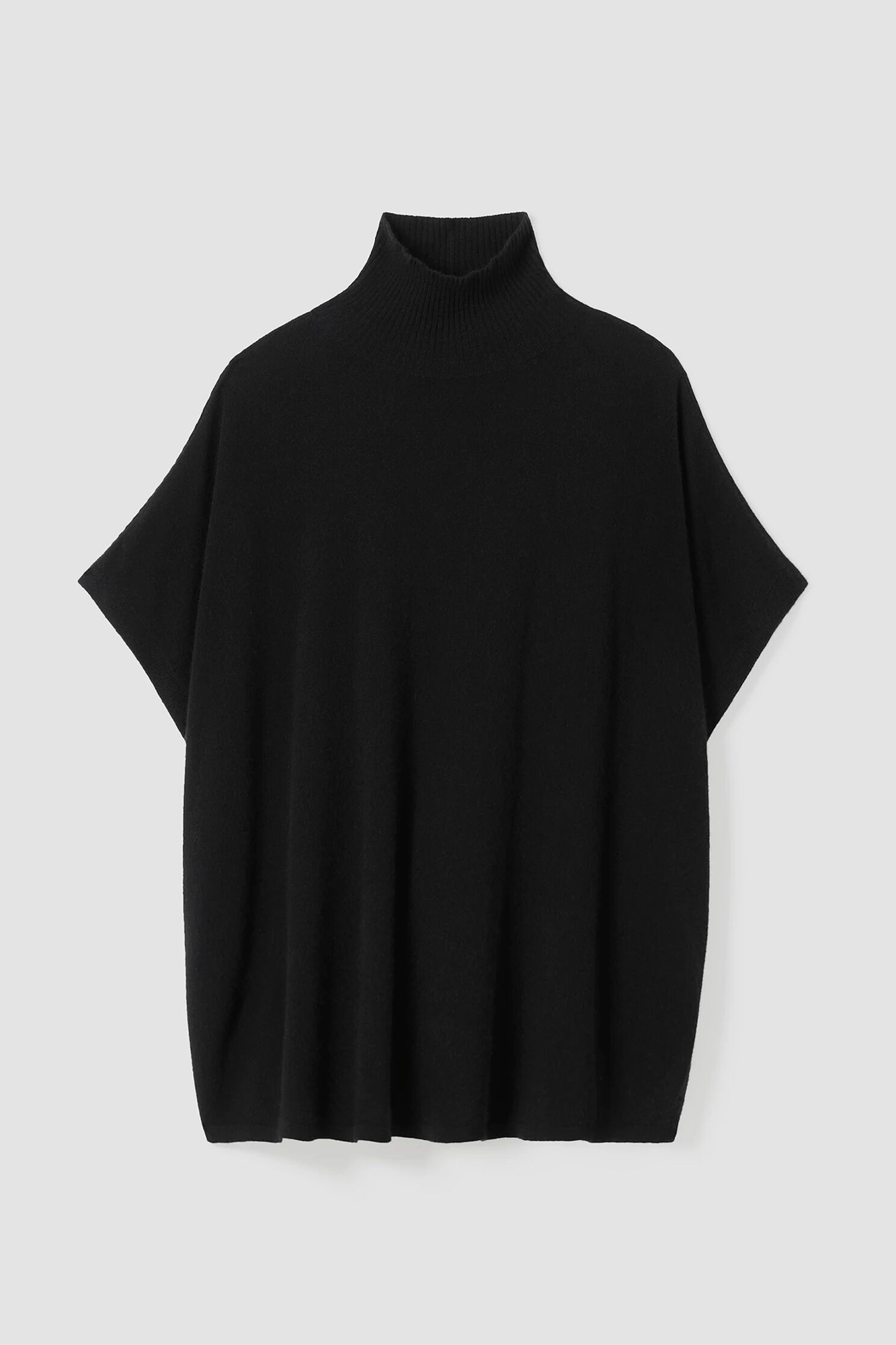 Stay cozy in the luxurious Italian cashmere Poncho from Eileen Fisher. Its turtleneck and streamlined design give you the best of both worlds without compromising on style. Wrap yourself in its plush and drapey fabric and stay warm all day.
