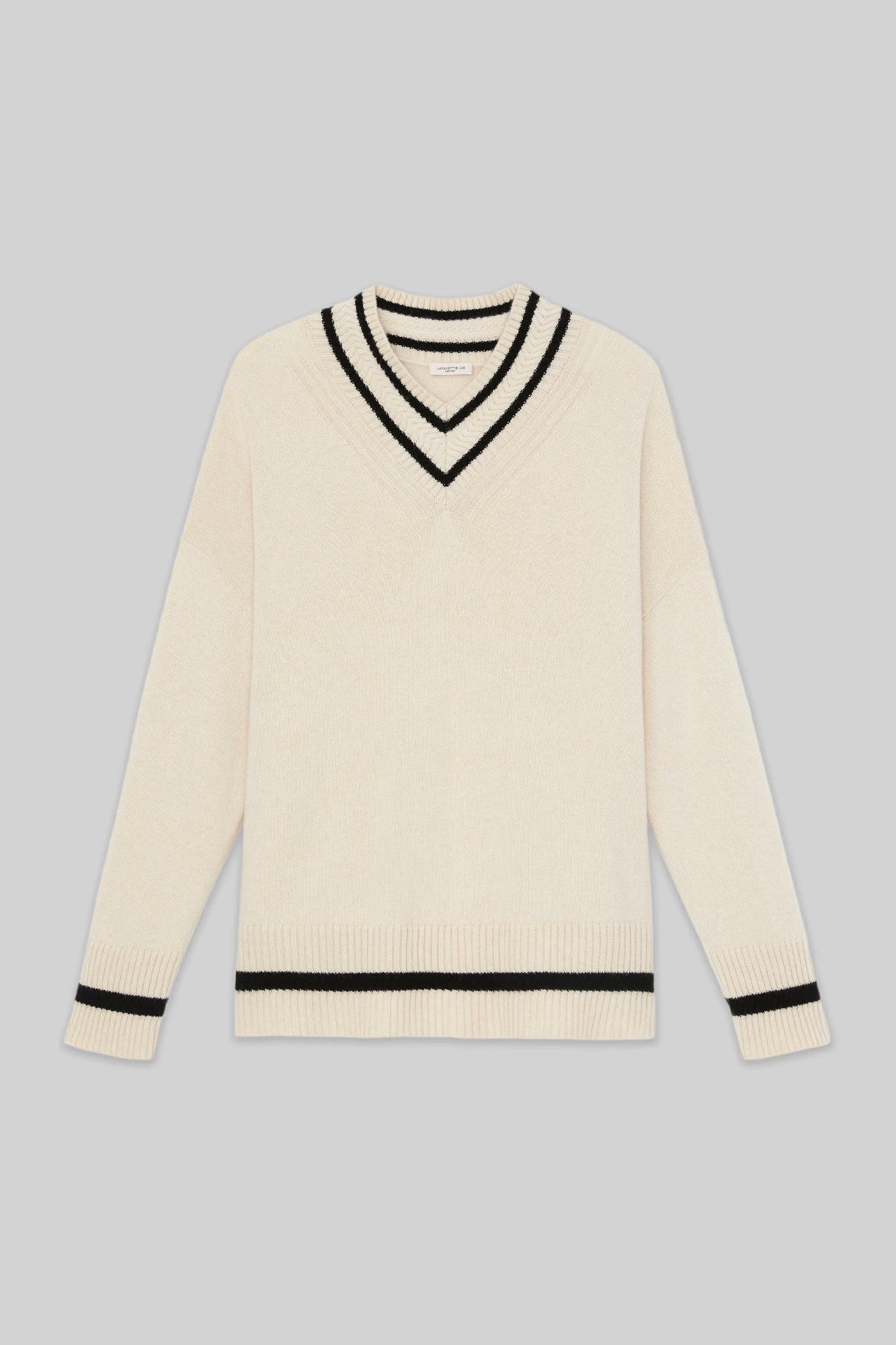 This Stripe Trim V-Neck Sweater from Lafayette 148 is crafted with precision and features classic Ivy League sartorial codes. It is expertly knit using luxurious 100% cashmere and is adorned with collegiate striped detailing and stacked ribbed trim. The relaxed fit includes drop shoulders, angled seaming, and a high-low hem. Perfect for Fall 2023.