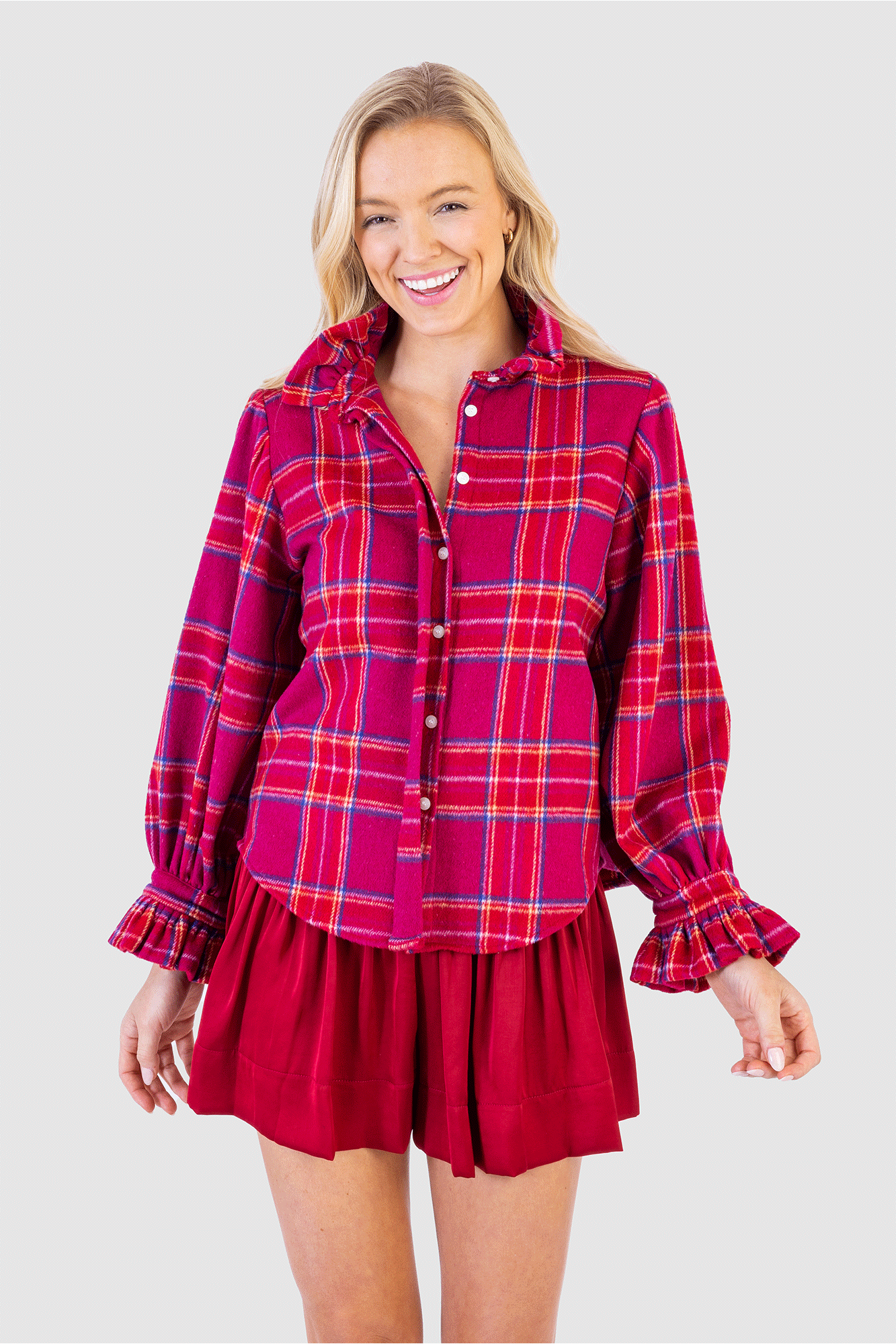 The Phoebe Top from Koch is crafted from lightweight flannel in a timeless Cranberry Plaid. This piece offers superior comfort in a stylish silhouette, making it perfect for any occasion. Accented with a ruffled sleeves for an elegant look, this top is sure to make a statement.