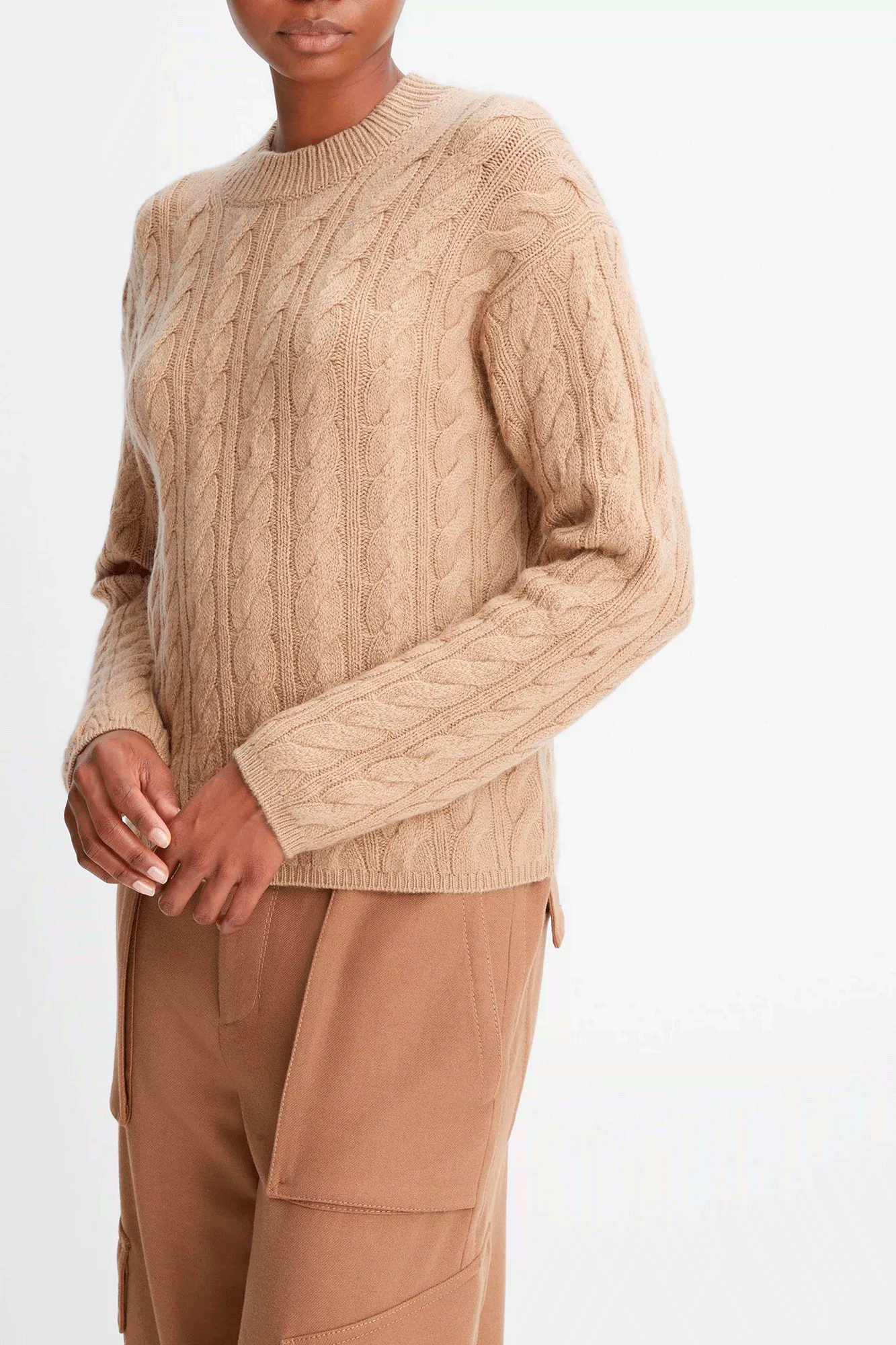 The Twist Cable Crop Crew from Vince is a premium knitted crew neck sweater made from a blend of luxurious wool and cashmere fibers. Its stylish cable pattern creates a flattering silhouette that will keep you cozy and warm. Enjoy superior comfort and style with this sophisticated wardrobe staple.