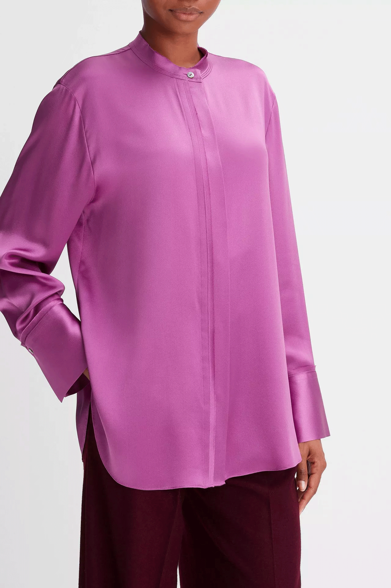 Upgrade your wardrobe with this Raw Edge Band Collar Blouse from Vince. Crafted from a luxurious silk satin and adorned with double-layer raw-edge stitching, this blouse exudes sophistication. A hidden placket adds a smooth, streamlined finish. Look and feel your best in this timeless classic.