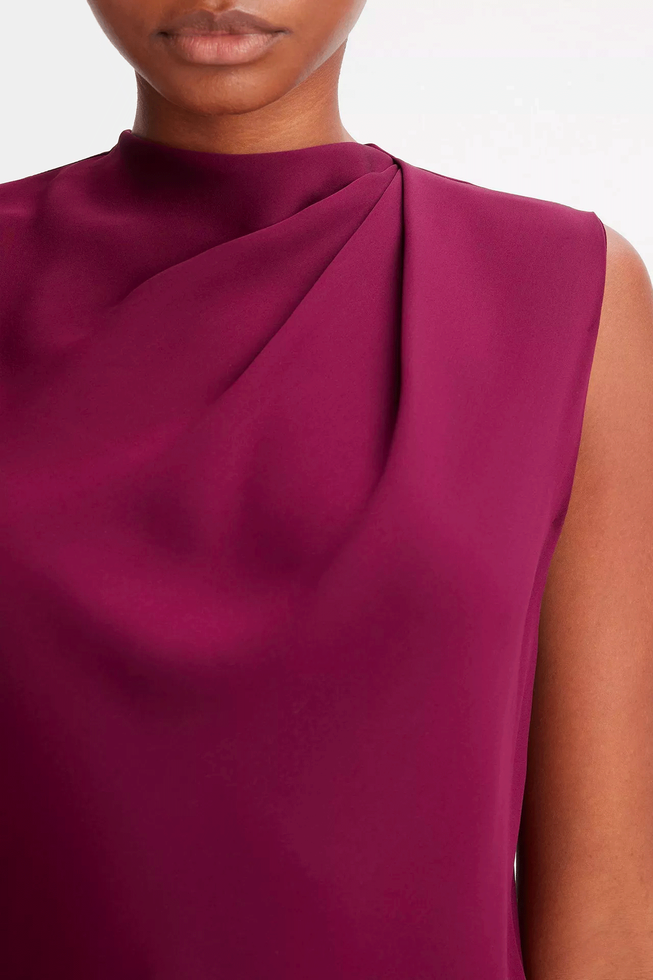 Our Draped Cascade Sleeveless Blouse adds an elegant touch to your outfit. Its lightly pleated shoulder creates a beautiful drape effect and is made from a stretch-silk crepe that moves with you. Perfect for tucking into trousers, skirts, or denim.