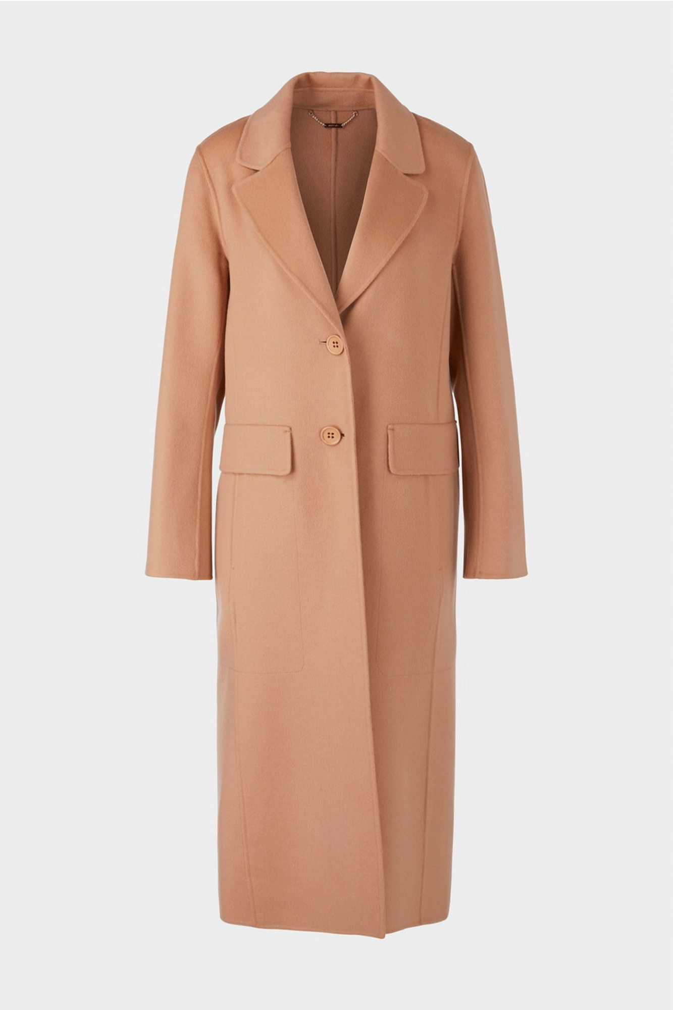 Stay warm in style with Marc Cain’s Long Double Coat. This 100% cotton coat features a chic double breasted design