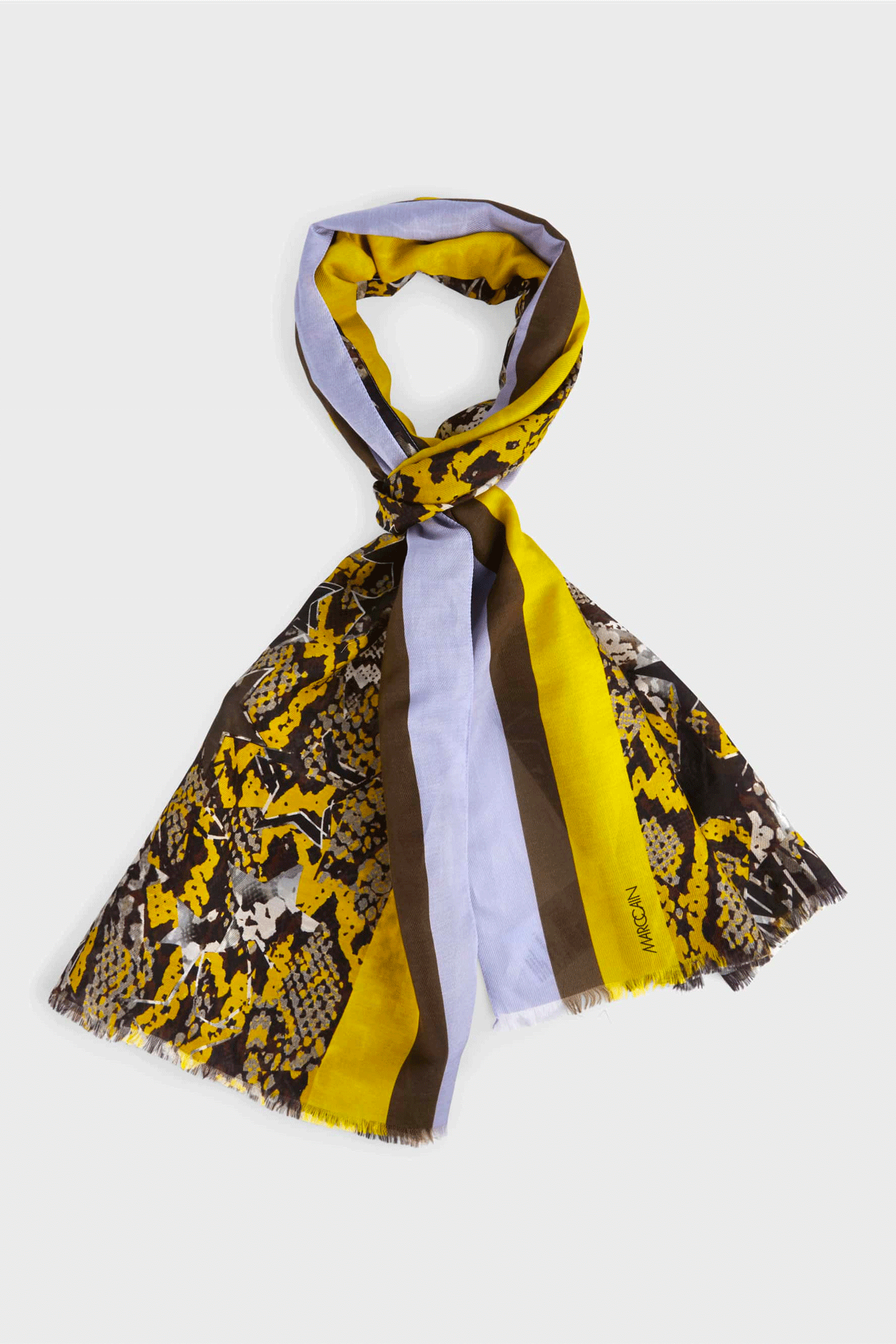 The Snaky Stars Scarf from Marc Cain combines the luxury of cotton and silk with a stylish mix of stripes, stars, and croc design. The exquisite crafting and fine fringes on the ends will make it a timeless accessory for any wardrobe.