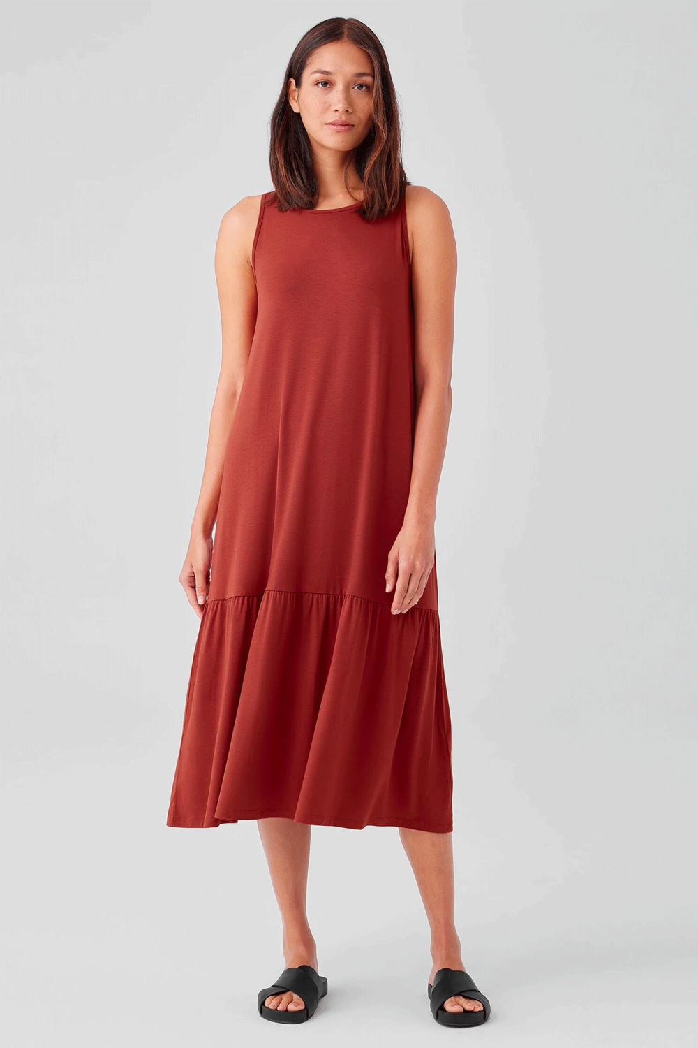 Designed for effortless elegance, the Fine Jersey Tiered Dress from Eileen Fisher features lightweight fabric and a classic tiered detail.