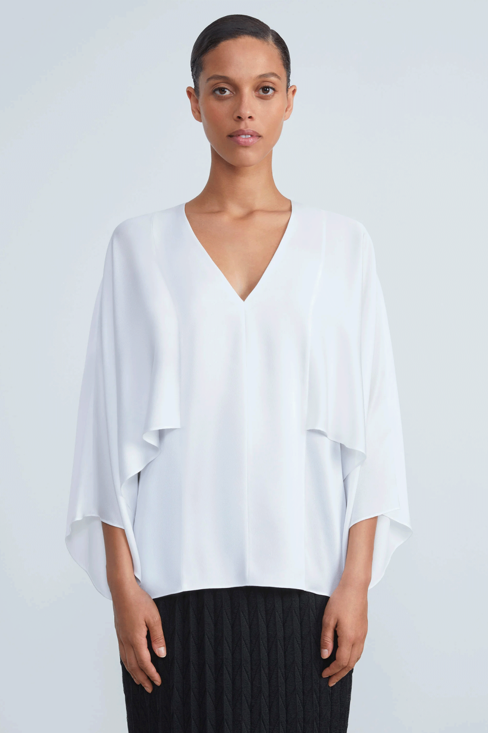 This beautiful long V-neck blouse from Lafayette 148 is crafted from light, lustrous satin