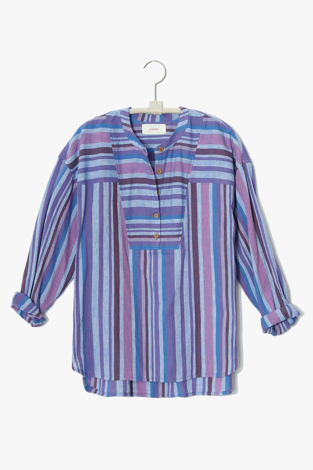The Macyn Top from Xirena is a multicolor washed cotton stripe. An easy button-front henley with a band collar, front yoke, box pleat back yoke,