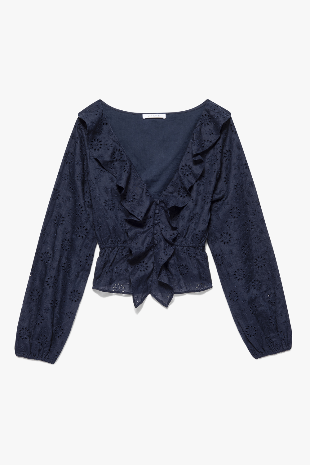 Ruffle Front Eyelet Long Sleeve Top from Frame airy blouse is embroidered with bespoke eyelet detailing, and finished with a feminine front ruffle.