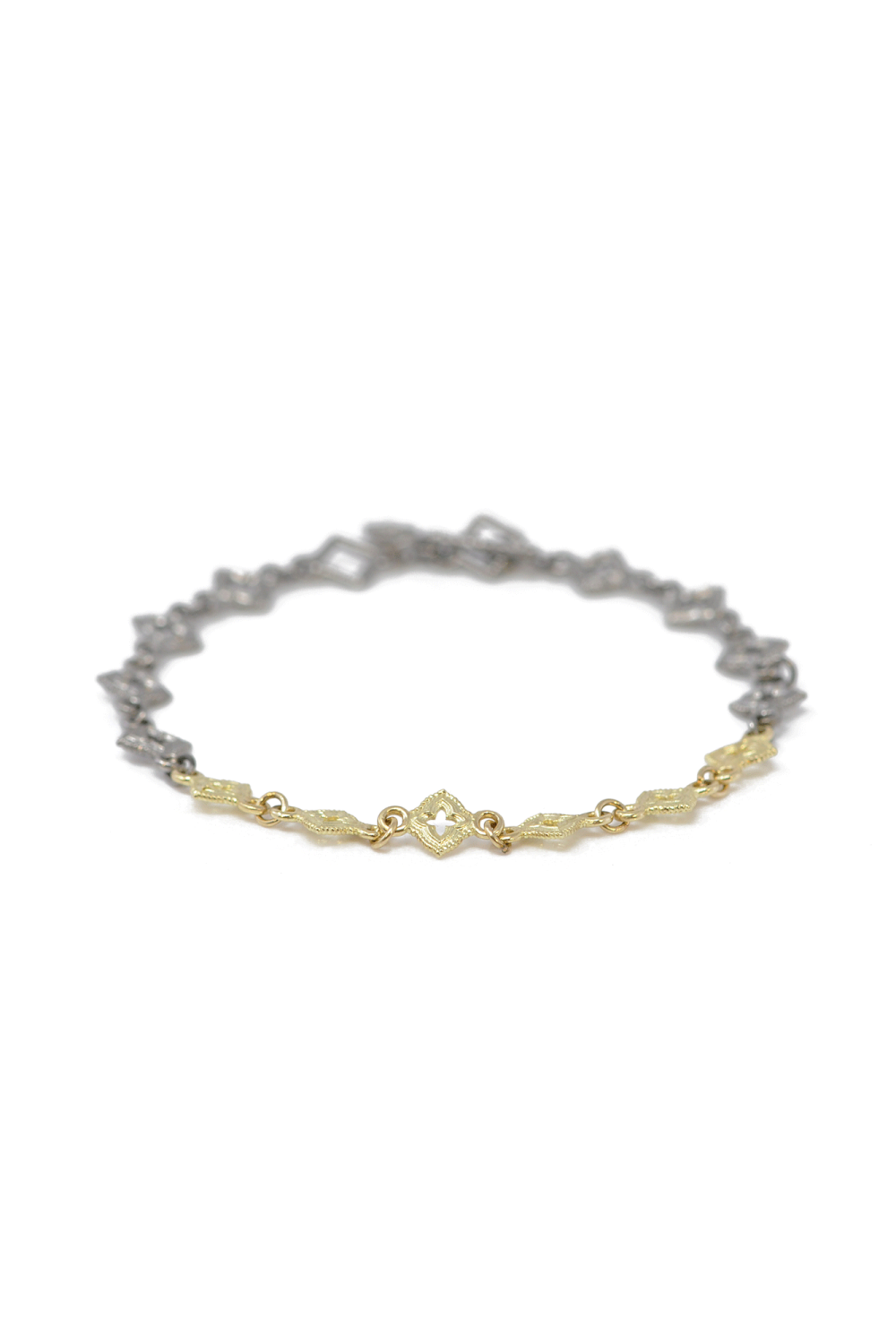 This elegant Scroll Bracelet from Armenta features a combination of 18kt yellow gold and grey sterling silver.